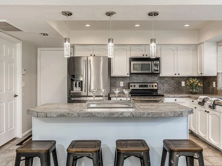 Beautiful kitchen with plenty of island seating and an eat in kitchen table!