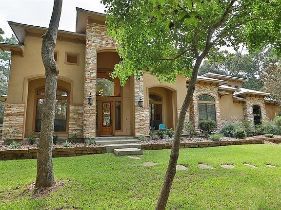 Front View Stucco and Stone exterior, metal roof and large covered front porch!