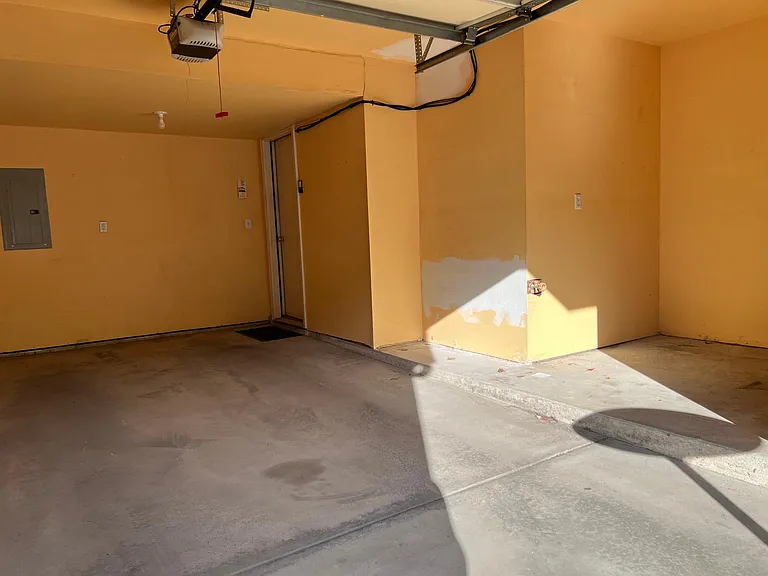 Attached one car garage with storage space