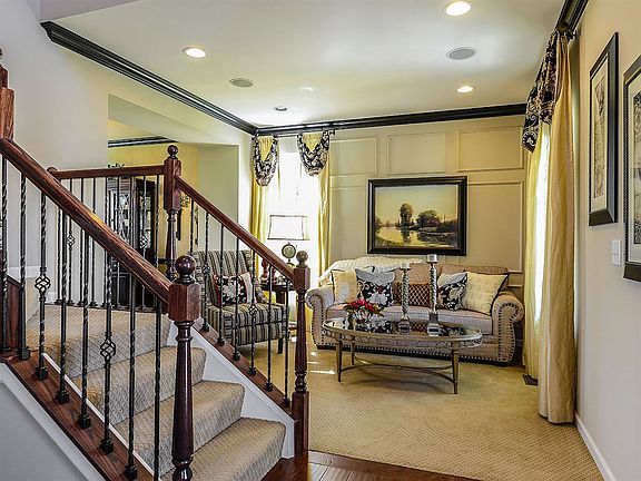 The front entryway welcomes guests with a stunning two story foyer and stairway access to the second