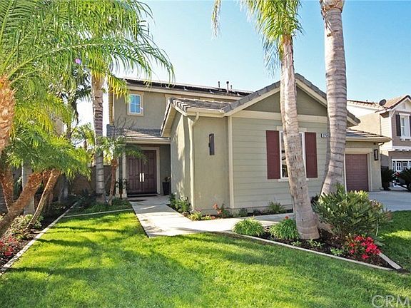 Professionally landscaped front and back yards