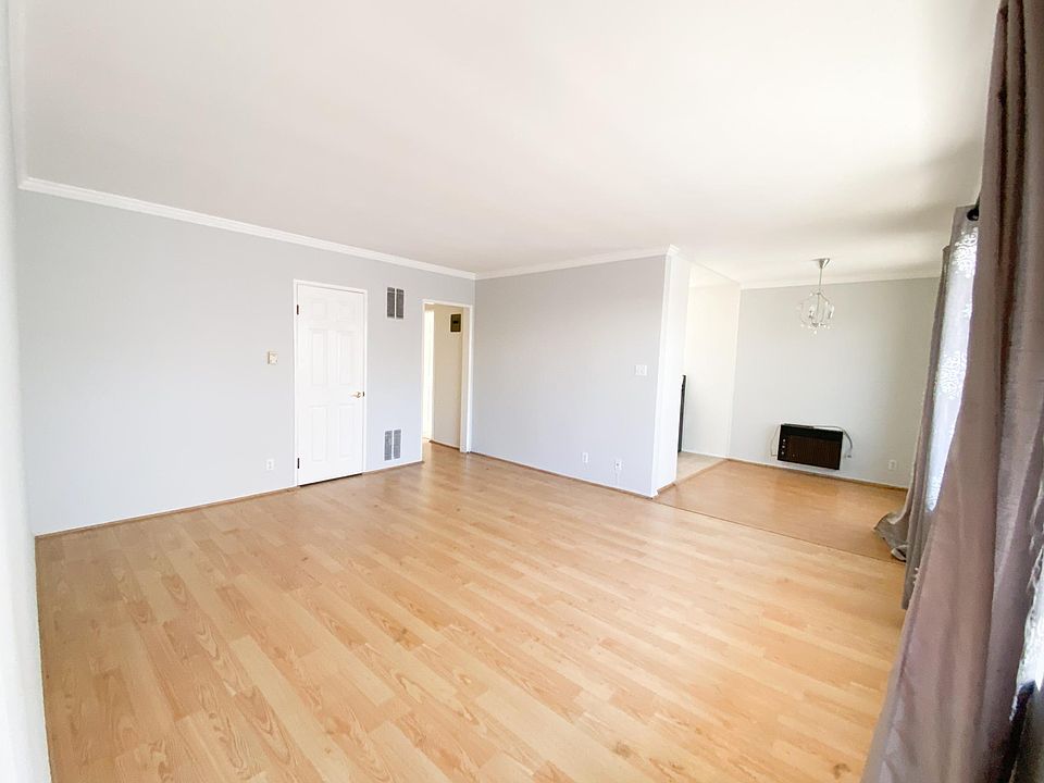 Living area with dining alcove.