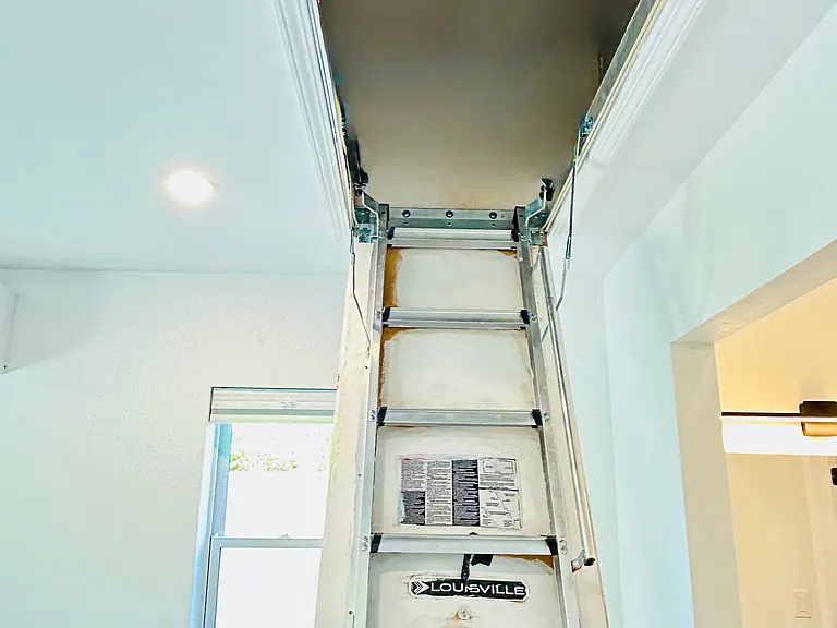 Extra storage with built in drop down ladder to attic!