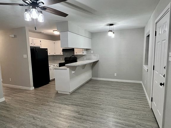 Kitchen with raised counter can be used as an eat in bar area, dining room area