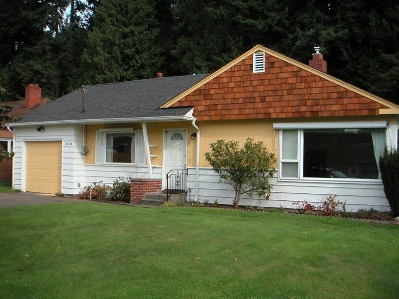 Freshly updated mid-century cottage is warm & inviting.