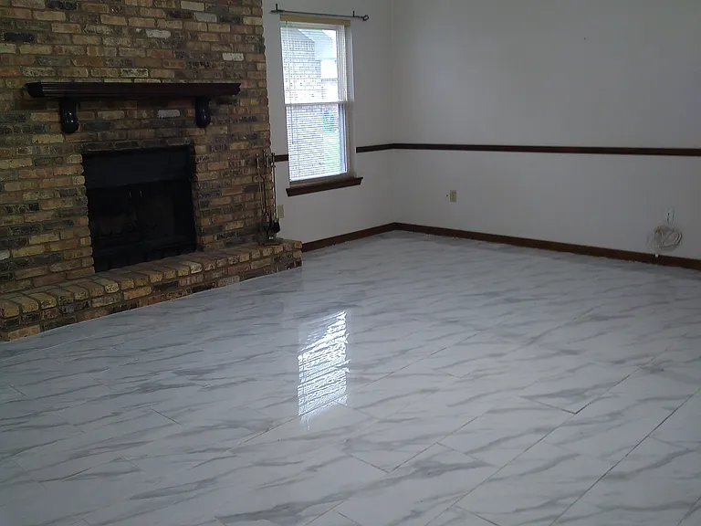 Living Room with fireplace and ceiling fan