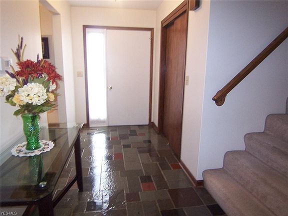 Large foyer. Formal living room to right upon entering. Stairs to 2nd level. Kitchen straight ahead, nice flow.