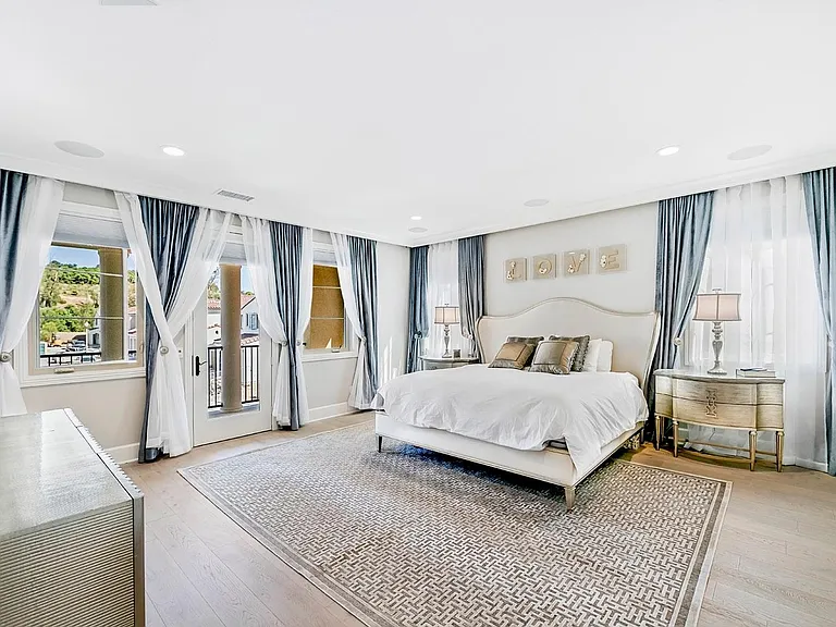 How rare to have such a beautiful view from your Grand Suite! Imagine waking up to looking at the Avocado Orchards every morning! The custom crown molding is backlit in a choice of colors for you, depending on your mood.