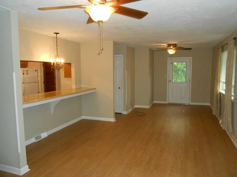 luncheon counter to the left/open living and dining area to