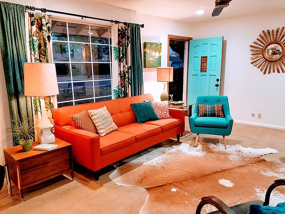 View of living room looking toward front door when furnished