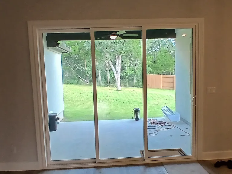 Triple sliding doors to back patio