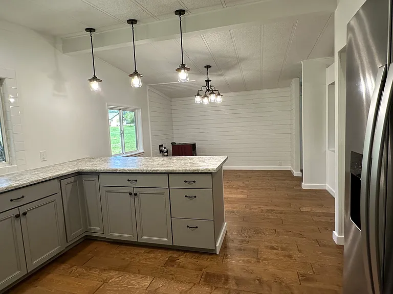 MODERN LIGHTING - COUNTER FOR BARSTOOLS - ALONG WITH BREAKFAST AREA