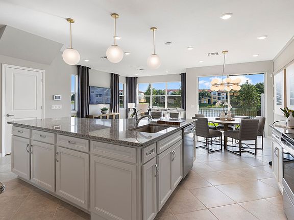 Naturally lit dining area that flows from the kitchen