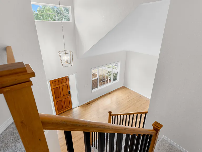 The upper level overlooks the bright, open main living spaces below, enhancing the home's airy layout and updated feel throughout.