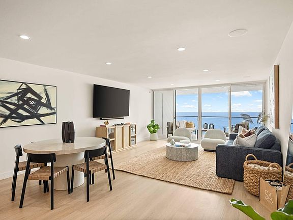 Enjoy the expansive ocean views from the dining table in the open living space.