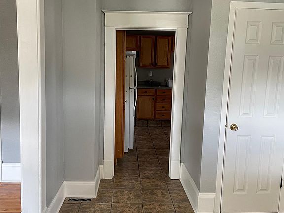 Standing at the main front door.