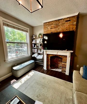 Giant picture window brings lots of light into front living room