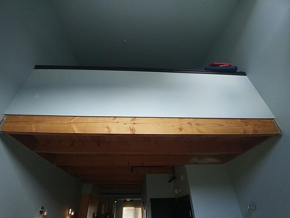 View from downstairs living area to the loft above 