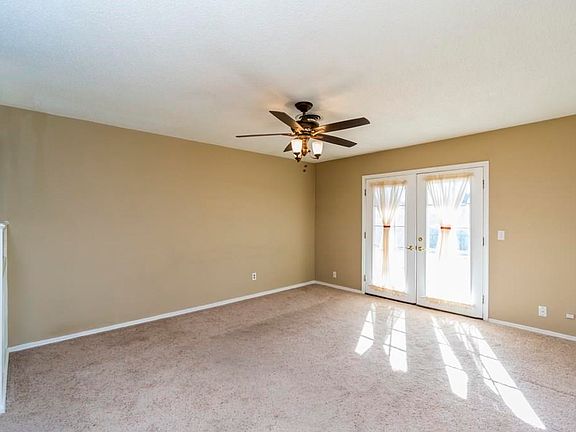 Living area with French doors to back yard.
