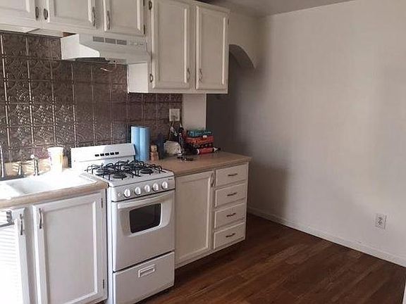 Updated kitchen with furnished gas range and refridgerator.