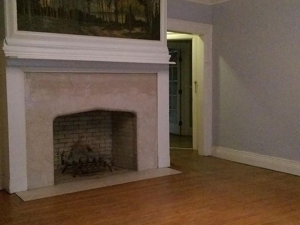 Another view of the fireplace, with entry to apt behind it t