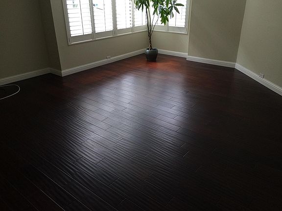 Large Living room with large windows and Plantation shutters.