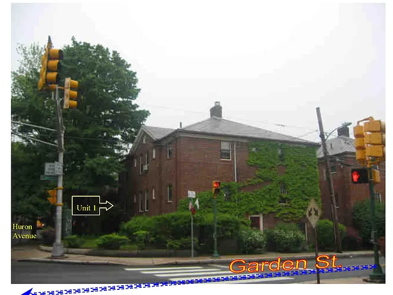 Solidly built brick building at the corner of Huron Avenue and Garden St., Cambridge.