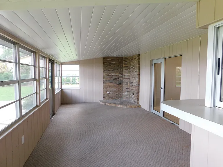 Here's a view of the porch area as we face north. The doors on the right lead to the kitchen nook.