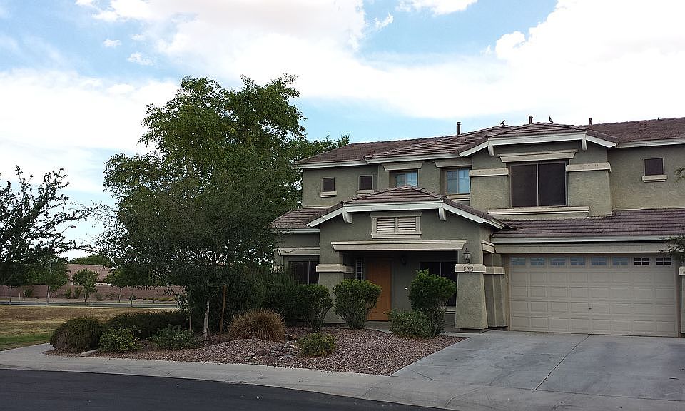 Front view of home with large grassy area next door!