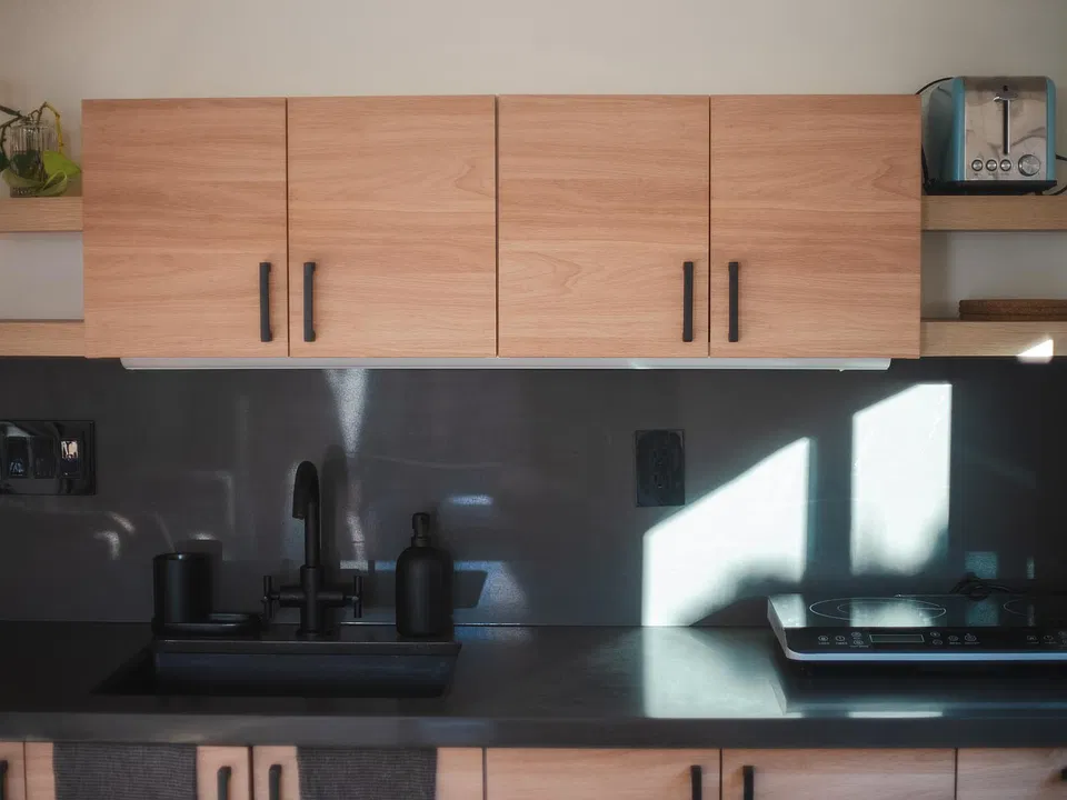 Kitchenette with 2-burner induction cooktop, combo microwave/convection/airfryer, blender, toaster, French press, and all the basics.