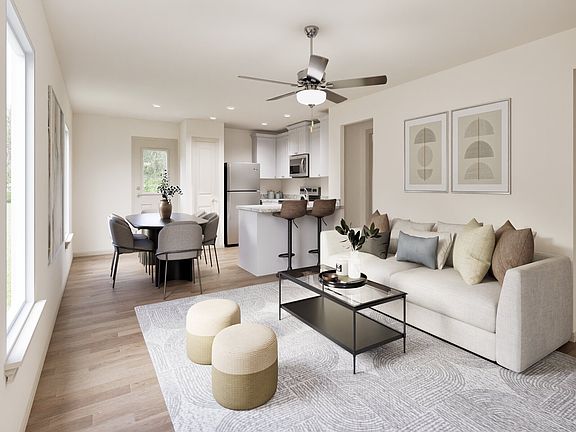Windows throughout the family room provide natural light