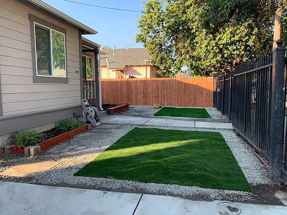 Front yard with rosemary growing in Garden bed. Ready for you to add your additional garden necessities!