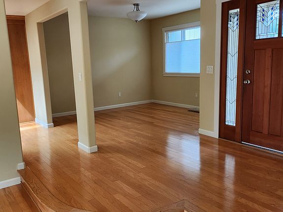 Entry way and dining room leading to kitchen