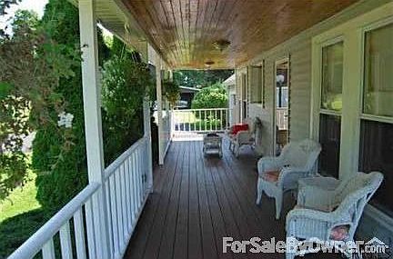 Front porch : A fantastic place to relax in the shade with a cool drink on hot Summer days.
