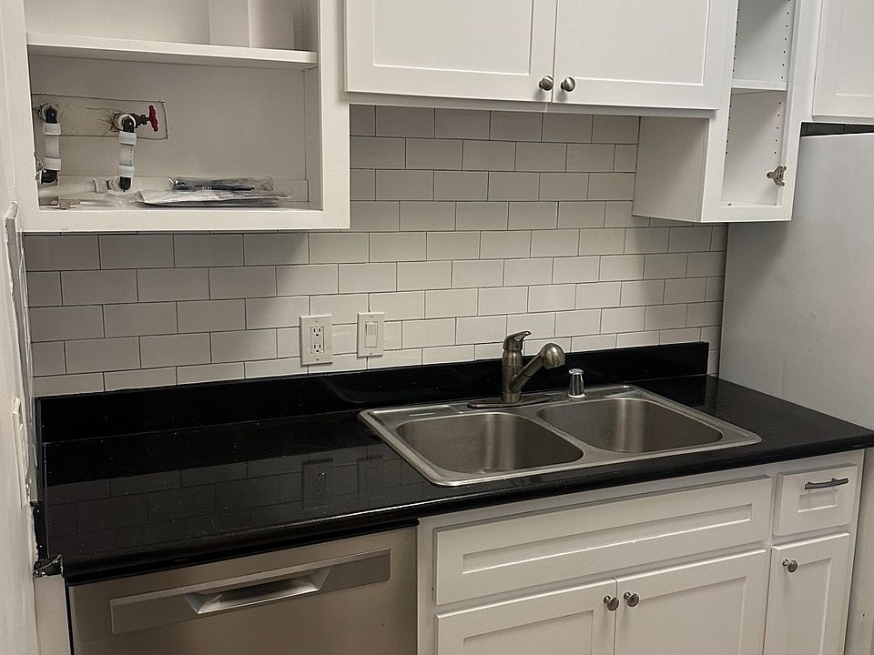 New kitchen (cabinet doors will be installed) features dishwasher and garbage disposal