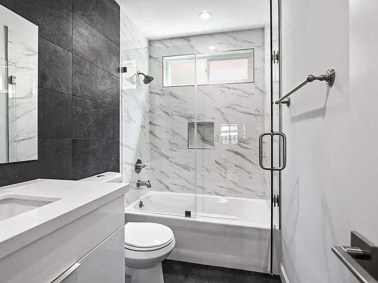 Bathroom with Shower-Bath with Glass Door and Vanity Cabinet Storage