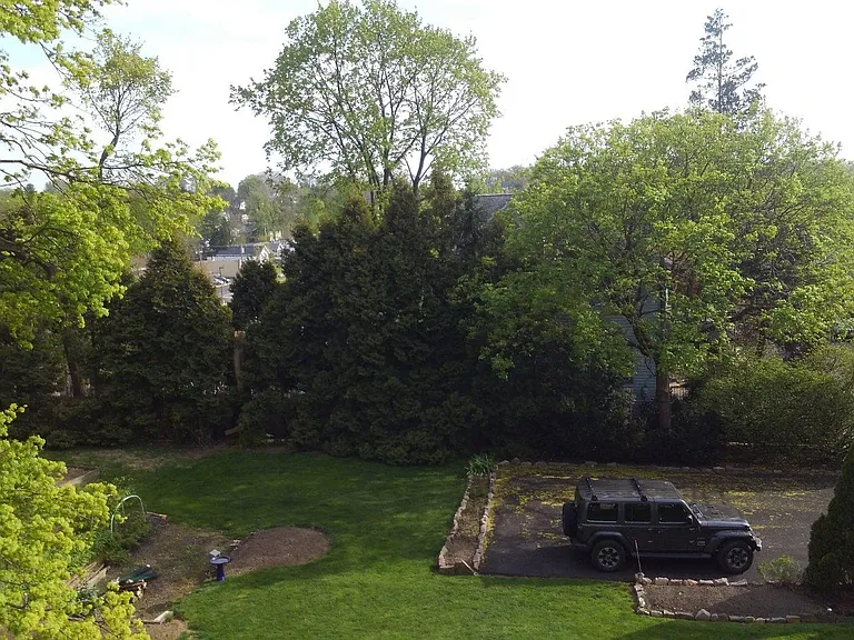 View of backyard/parking area from 3rd floor kitchen.