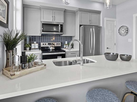 A photo of the kitchen of the Coltrane townhome model by Brookfield Residential