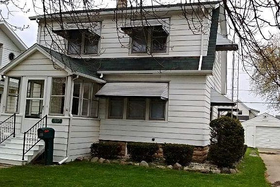 Front of house, drive, garage