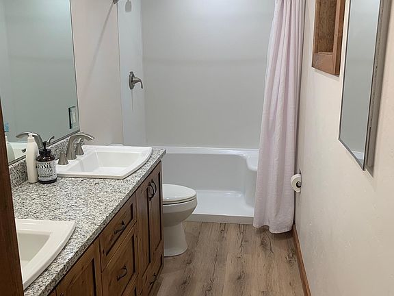 Easy step in shower with easy to clean Kohler Choreograph walls.