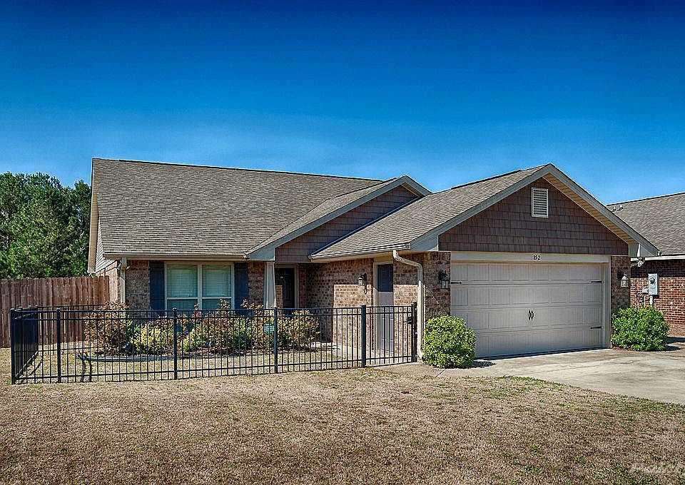 Wonderful full brick home situated on a large corner lot with complete with a sprinkler system and c