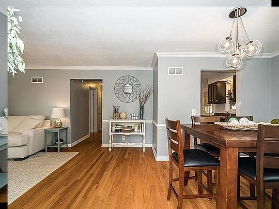 Standing in front door; fireplace is to the left.