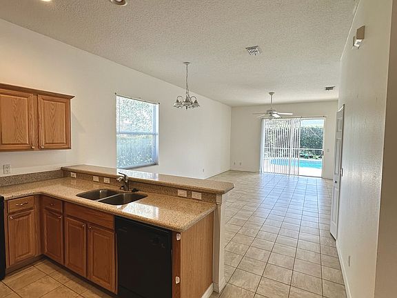 Kitchen view to living room and pool