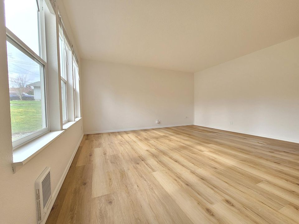 Light and bright living room with large windows.
