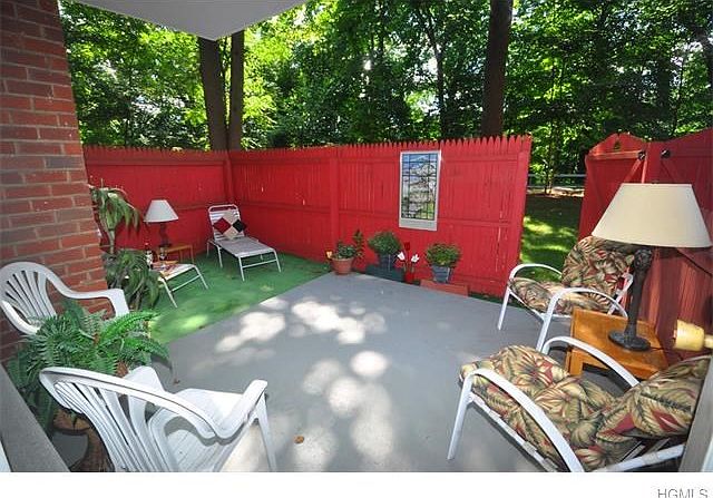 Oversized backyard fenced terrace.