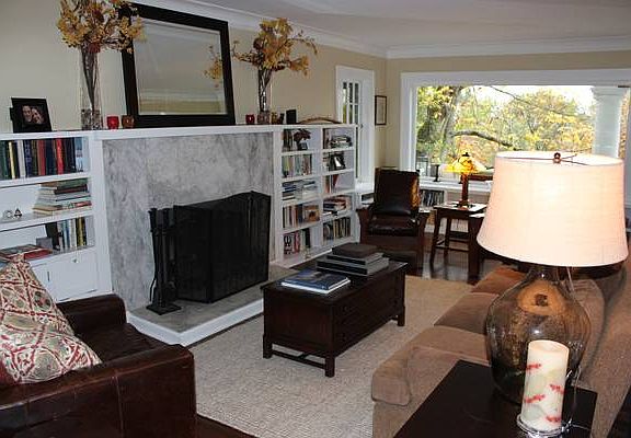 Living Room with bay window and built in bookshelves