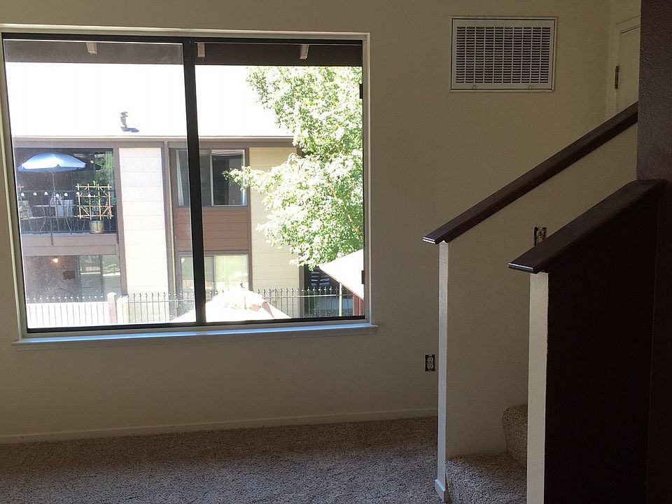 living area with big window overlooking pool