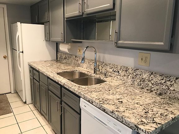 Kitchen granite, new stainless sink & faucet. Refrig at end 