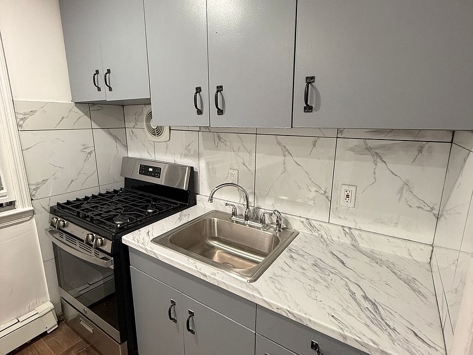Kitchen space with newly renovated countertops/cabinets and oven included.