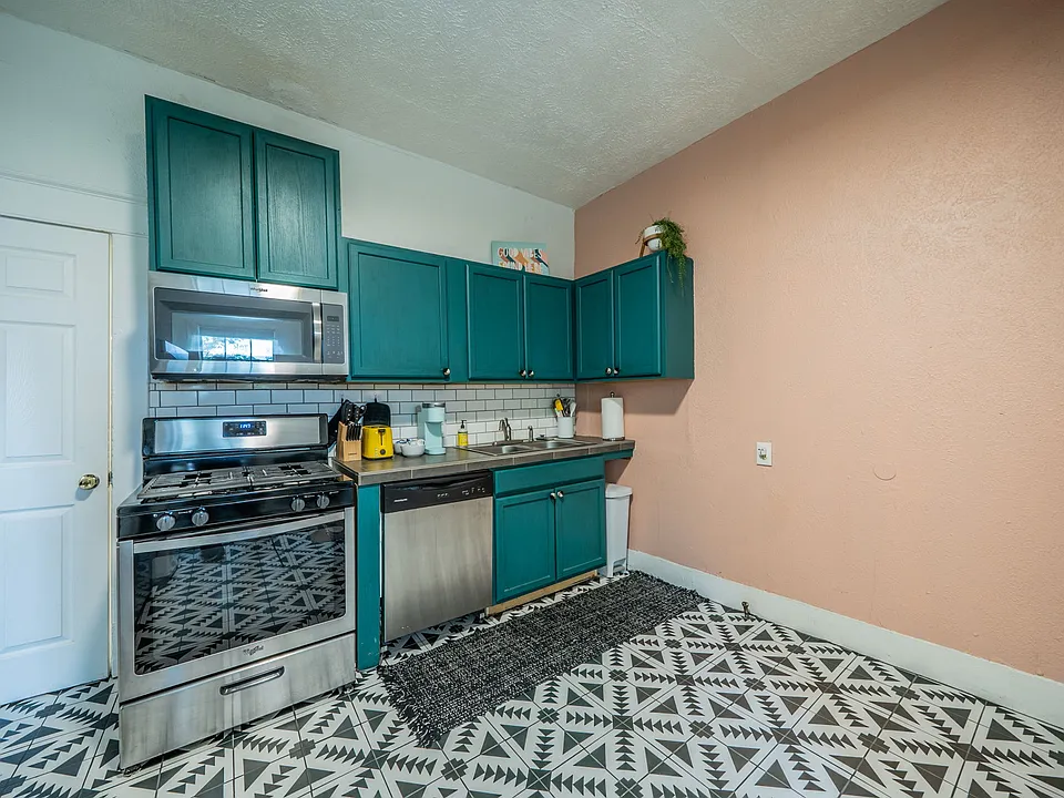 Cook in style with vibrant decor and high-end stainless appliances.